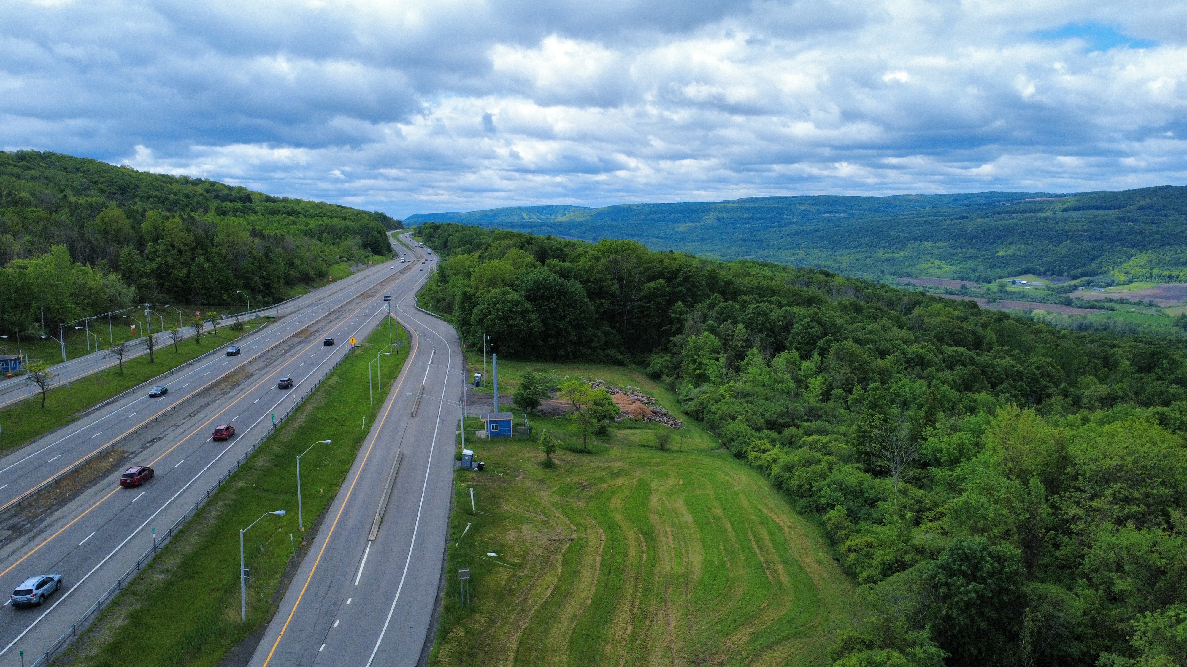 Aerial highway through green landscape