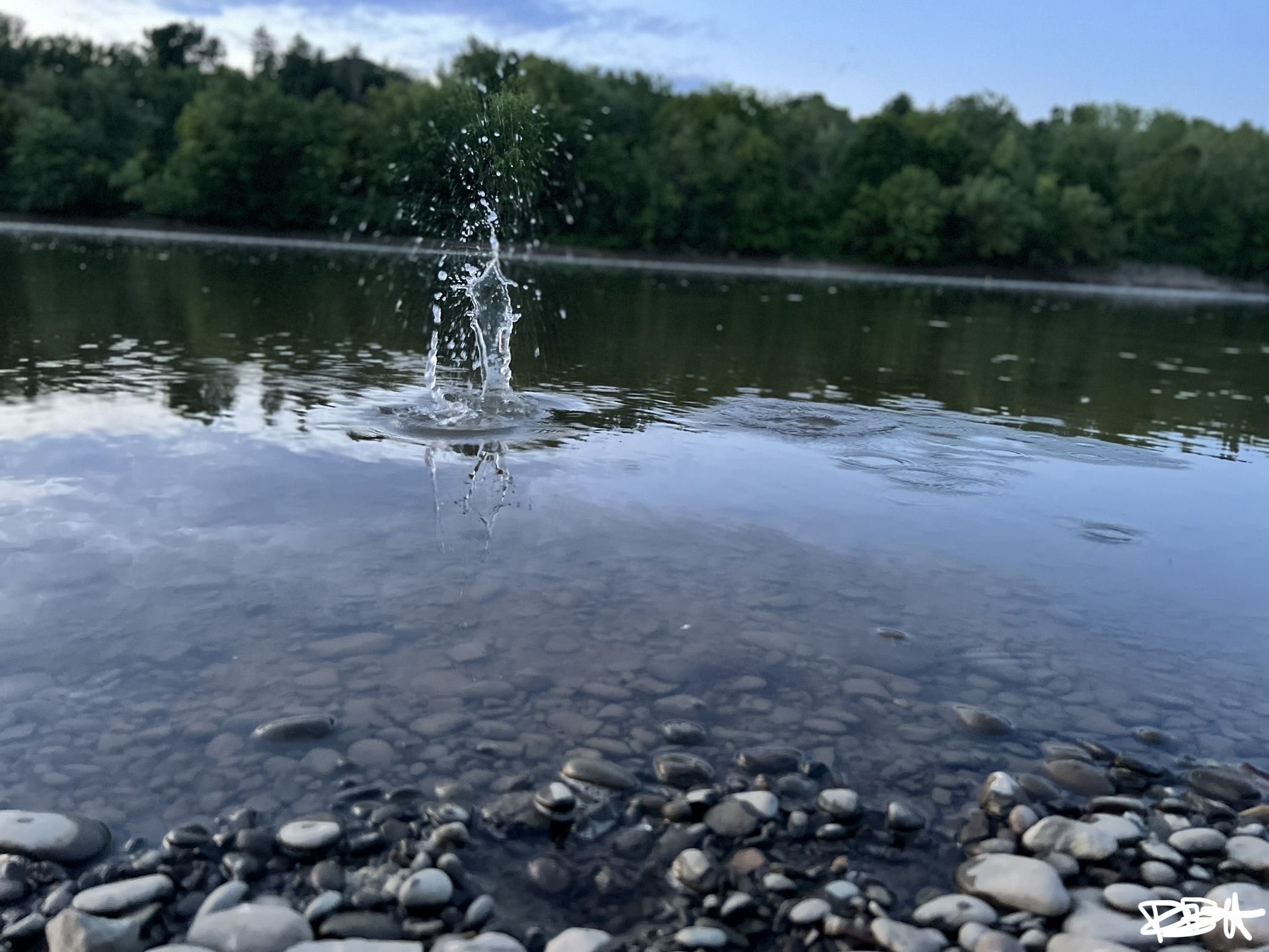 Water splash on a calm river